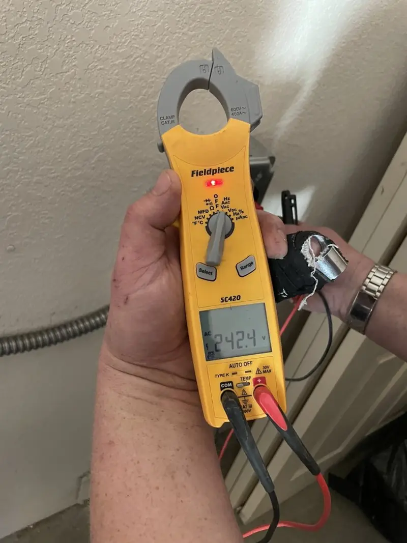 Voltage testing with clamp meter during Whole House Surge Protector in Medford